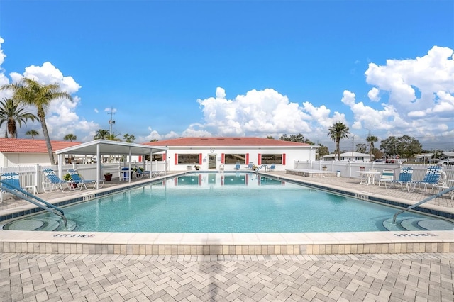 view of swimming pool featuring a patio area