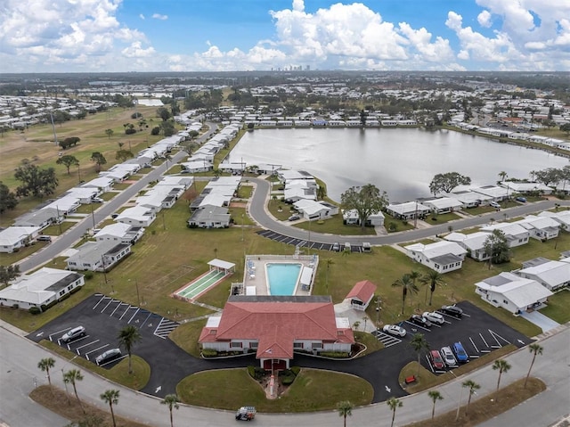 birds eye view of property with a water view