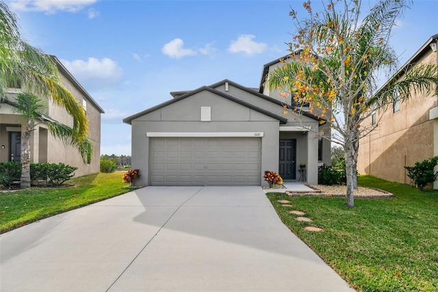 view of front of house featuring a garage and a front lawn