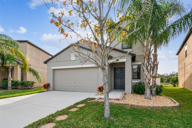 view of front of home with driveway, a front lawn, an attached garage, and stucco siding