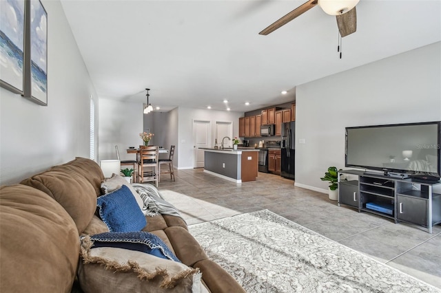 living room with sink and ceiling fan