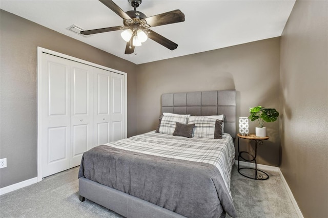 bedroom with light carpet, ceiling fan, and a closet