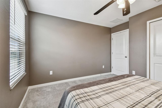 unfurnished bedroom with ceiling fan and carpet