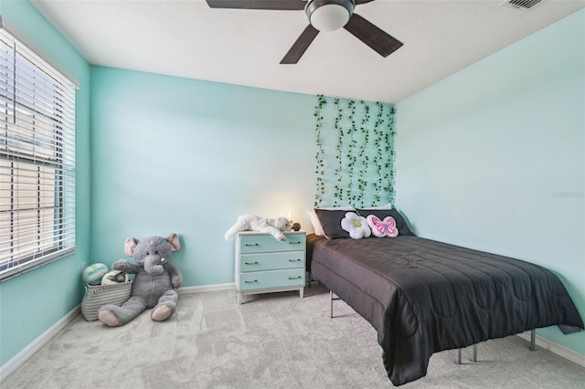 carpeted bedroom featuring ceiling fan