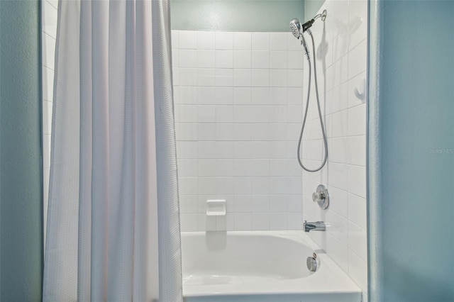 bathroom featuring shower / bathtub combination with curtain