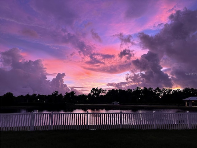 pool at dusk with a water view