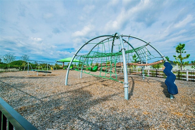 community jungle gym featuring fence