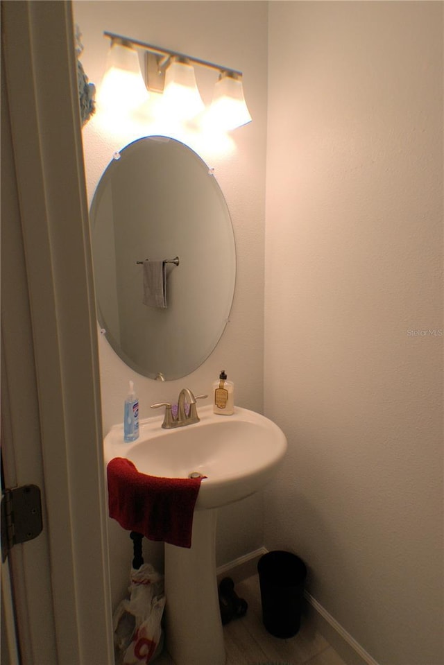 bathroom with tile patterned floors