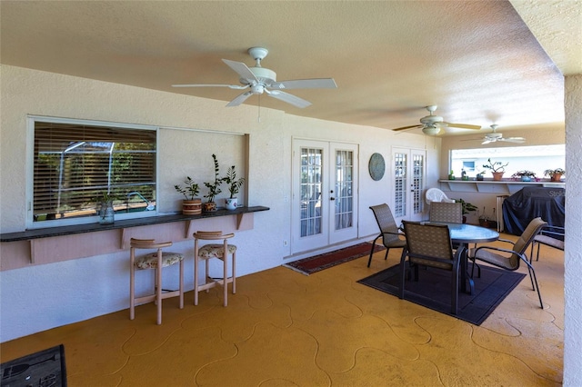 view of patio / terrace featuring a grill, french doors, and ceiling fan