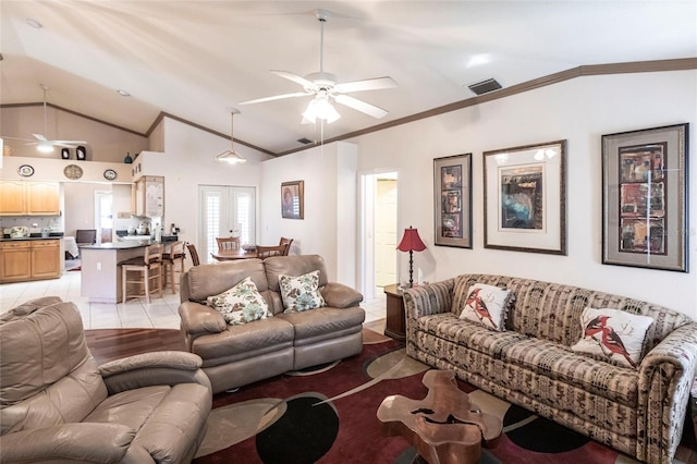 living room featuring crown molding, lofted ceiling, light tile patterned flooring, and ceiling fan