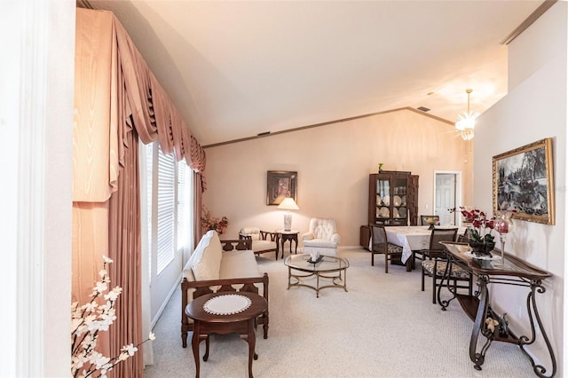 sitting room featuring carpet floors, vaulted ceiling, and a notable chandelier