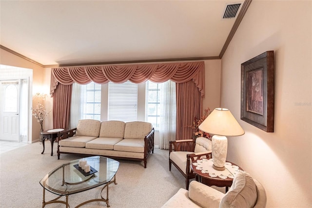 carpeted living room featuring crown molding and lofted ceiling