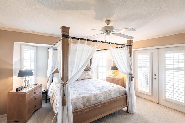 bedroom featuring ornamental molding, carpet floors, and multiple windows