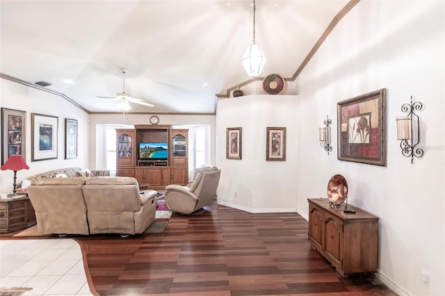 living room featuring crown molding, ceiling fan, vaulted ceiling, and hardwood / wood-style flooring