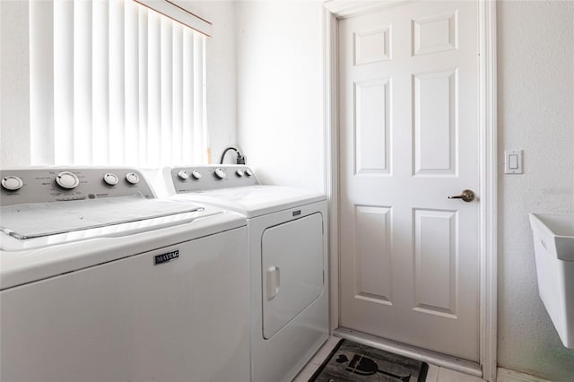 laundry area featuring washer and clothes dryer