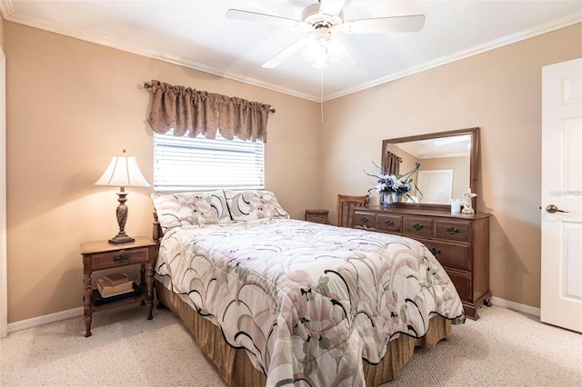 bedroom featuring ornamental molding, light colored carpet, and ceiling fan