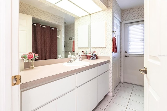 bathroom with tile patterned flooring and vanity