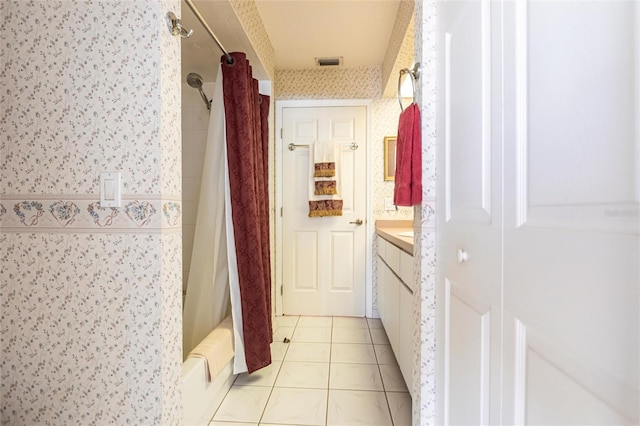 bathroom with vanity, shower / tub combo, and tile patterned floors