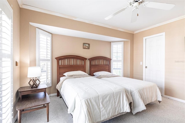 bedroom with ornamental molding, carpet flooring, and ceiling fan