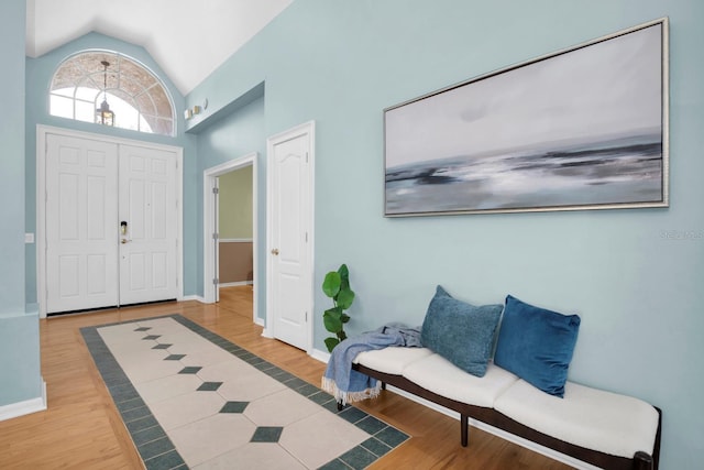 entryway featuring vaulted ceiling and hardwood / wood-style floors