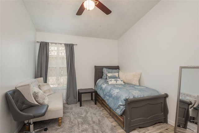 bedroom featuring lofted ceiling, hardwood / wood-style floors, and ceiling fan