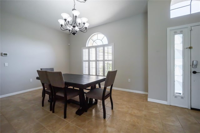 dining area featuring an inviting chandelier