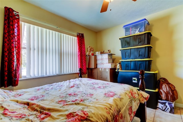 bedroom featuring tile patterned flooring and ceiling fan