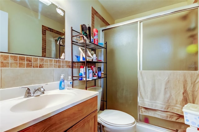 bathroom featuring walk in shower, toilet, and decorative backsplash