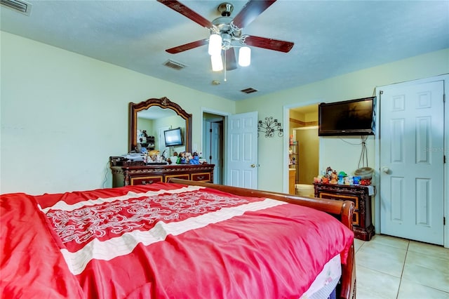 tiled bedroom with ceiling fan