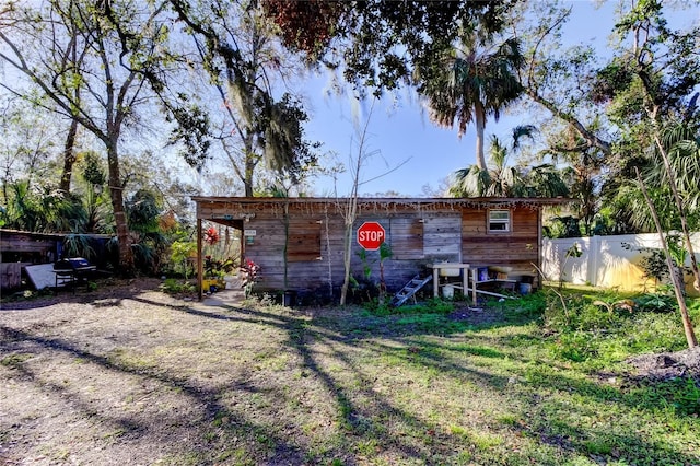 view of outbuilding featuring a yard