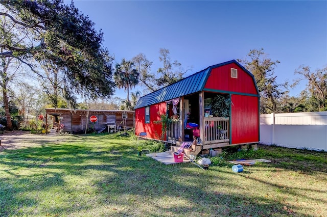 view of outdoor structure featuring a lawn