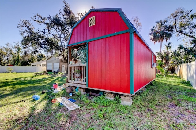 view of outbuilding with a yard