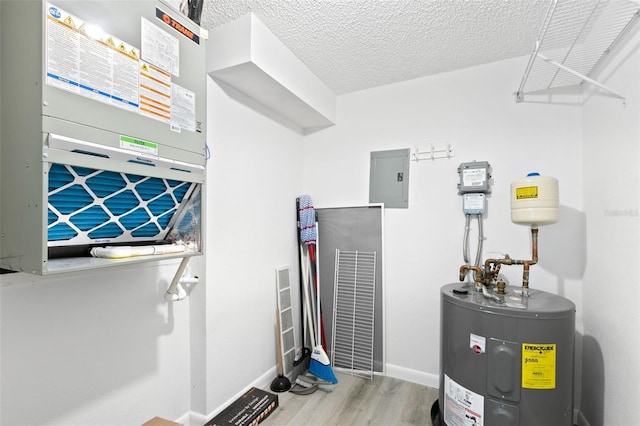 utility room with water heater and electric panel