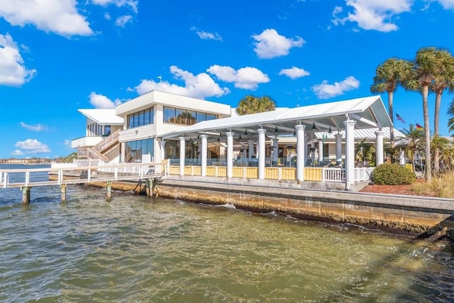 rear view of property featuring a water view