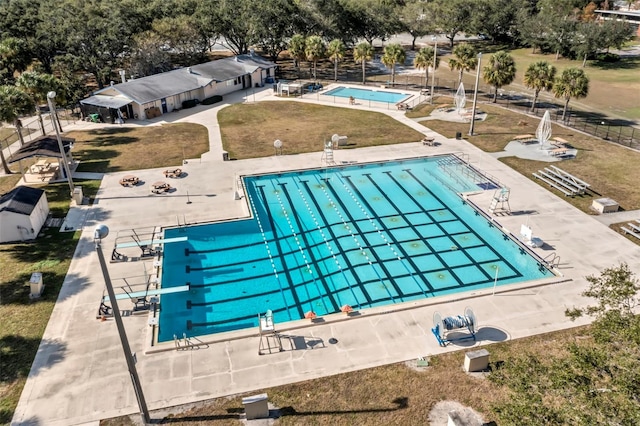 view of pool with a yard and a patio area