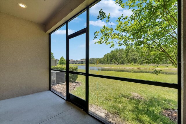4899 Isola Ct, Wesley Chapel, FL 33543 - unfurnished sunroom with a water view