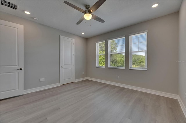 4899 Isola Ct, Wesley Chapel, FL 33543 - unfurnished bedroom featuring light wood finished floors, baseboards, recessed lighting, and ceiling fan