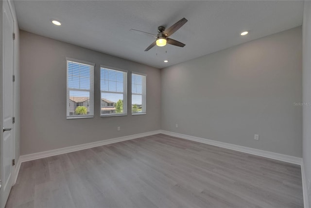 4899 Isola Ct, Wesley Chapel, FL 33543 - empty room with ceiling fan, wood finished floors, recessed lighting, and baseboards