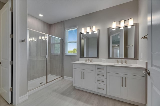 4899 Isola Ct, Wesley Chapel, FL 33543 - full bath featuring a stall shower, double vanity, baseboards, and recessed lighting