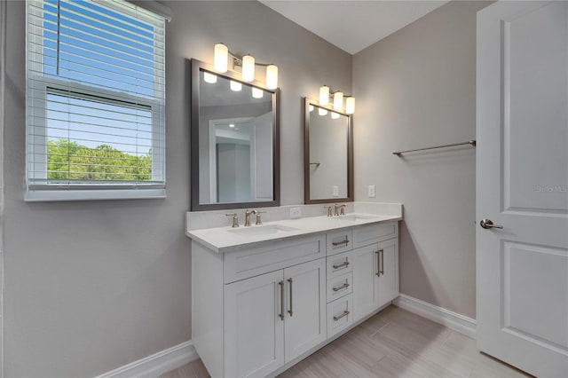 4899 Isola Ct, Wesley Chapel, FL 33543 - full bath with baseboards and double vanity