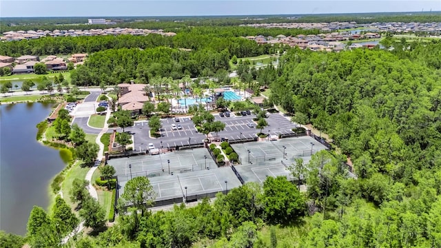 4899 Isola Ct, Wesley Chapel, FL 33543 - view of property location with a nearby body of water and a heavily wooded area