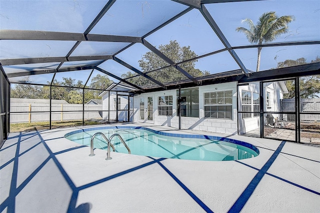 view of pool featuring a lanai and a patio area