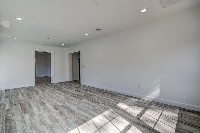 spare room featuring light wood-type flooring