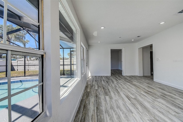 spare room with light hardwood / wood-style floors