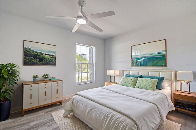 bedroom featuring ceiling fan and light hardwood / wood-style floors