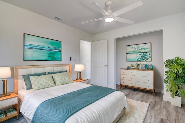 bedroom featuring ceiling fan and light hardwood / wood-style floors