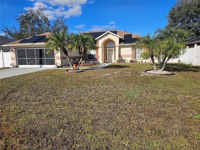 ranch-style house with a front lawn and solar panels