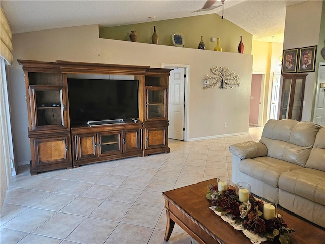 living room with light tile patterned floors and vaulted ceiling