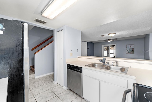 kitchen with sink, a textured ceiling, ceiling fan, stainless steel appliances, and white cabinets