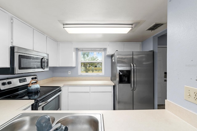 kitchen featuring white cabinetry, sink, and stainless steel appliances